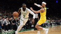 Boston Celtics guard Jaylen Brown (7) controls the ball while Indiana Pacers guard Andrew Nembhard (2) defends during the second half at TD Garden.