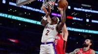 Los Angeles Lakers forward Jarred Vanderbilt (2) shoots against Houston Rockets center Alperen Sengun (28) and center Steven Adams (12) during the first half at Crypto.com Arena.