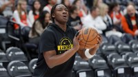 Los Angeles Lakers guard Adou Thiero (1) warms up before a game against the Utah Jazz at Delta Center.