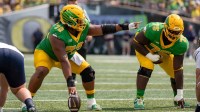 Oregon offensive linemen Iapani Laloulu, left, and Emmanuel Pregnon line up as the Oregon Ducks host the Montana State Bobcats.