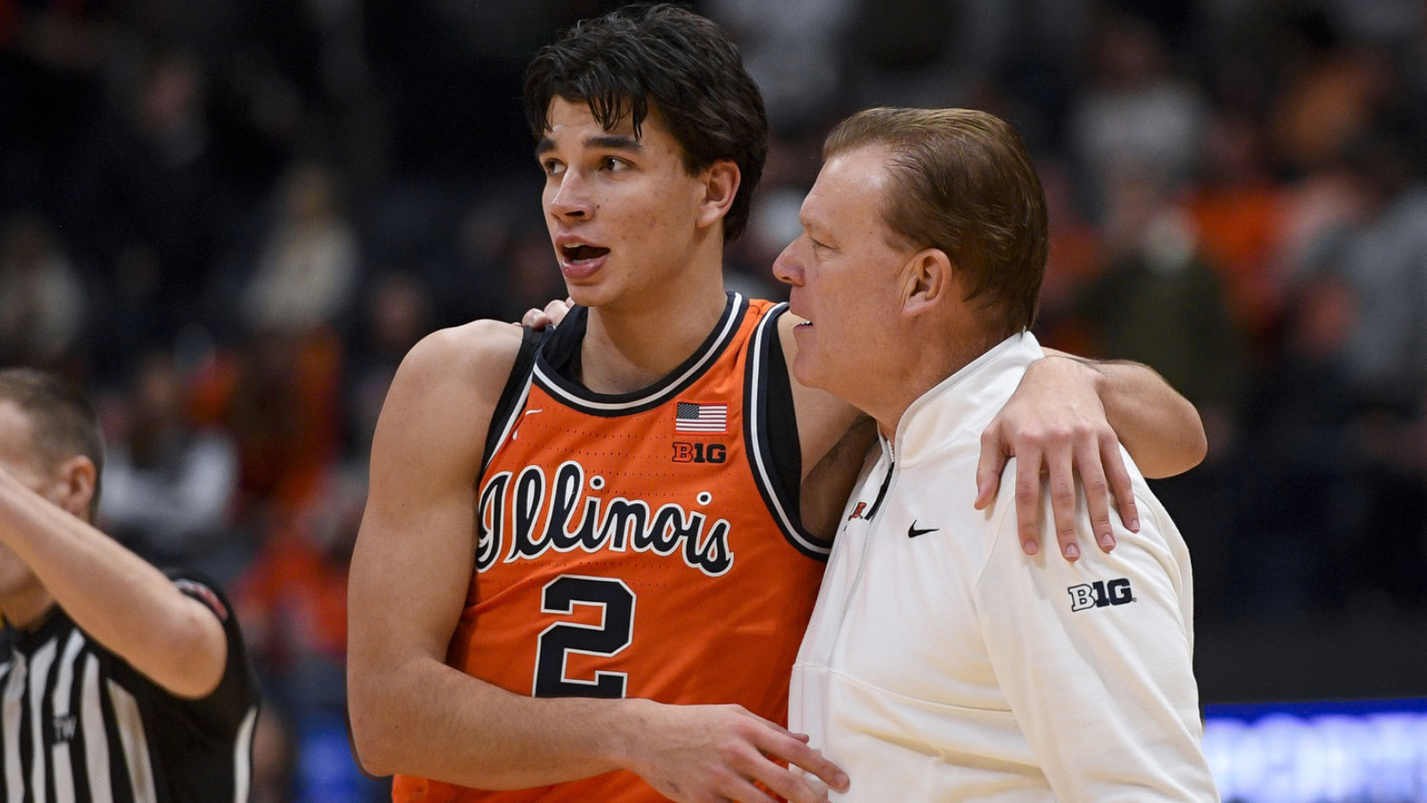 Illinois Fighting Illini guard Andrej Stojakovic (2) celebrates the win with head coach Brad Underwood against the Tennessee Volunteers during the second half at Bridgestone Arena.