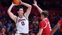 Illinois Fighting Illini forward David Mirkovic (0) looks to pass as Nebraska Cornhuskers forward Braden Frager (5) defends during the first half at State Farm Center.