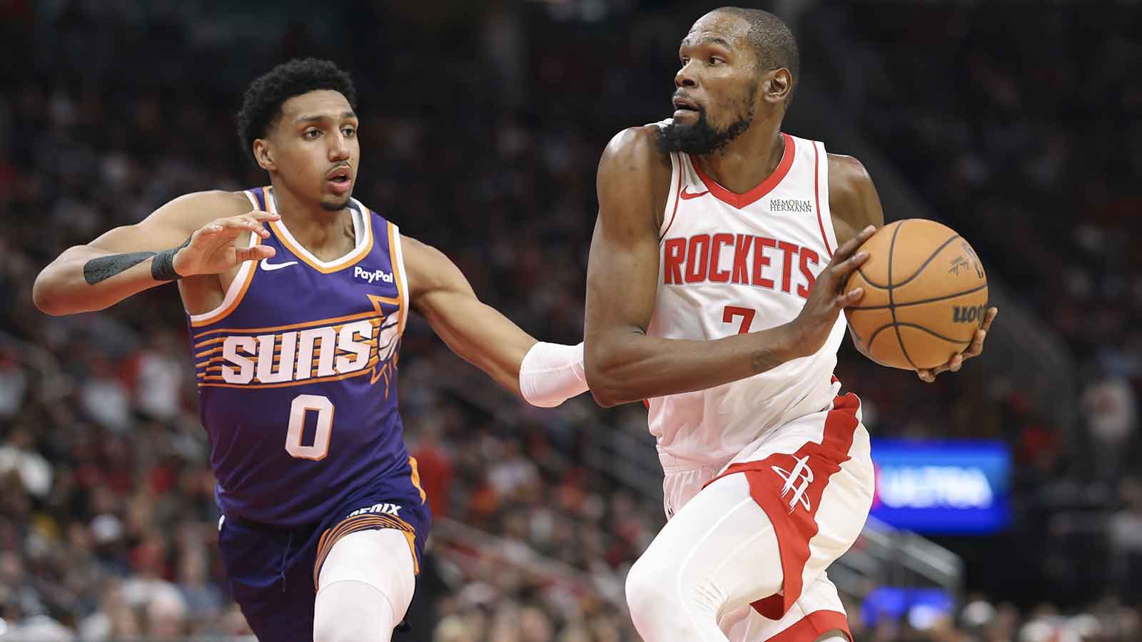 Houston Rockets forward Kevin Durant (7) drives witht the ball as Phoenix Suns forward Ryan Dunn (0) defends during the second quarter at Toyota Center.