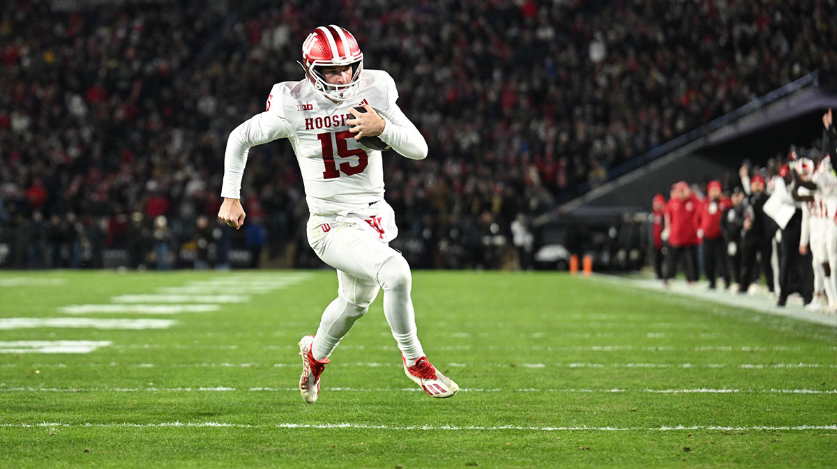 Indiana Hoosiers quarterback Fernando Mendoza (15) rushes for a touchdown during the second quarter against the Purdue Boilermakers at Ross-Ade Stadium.