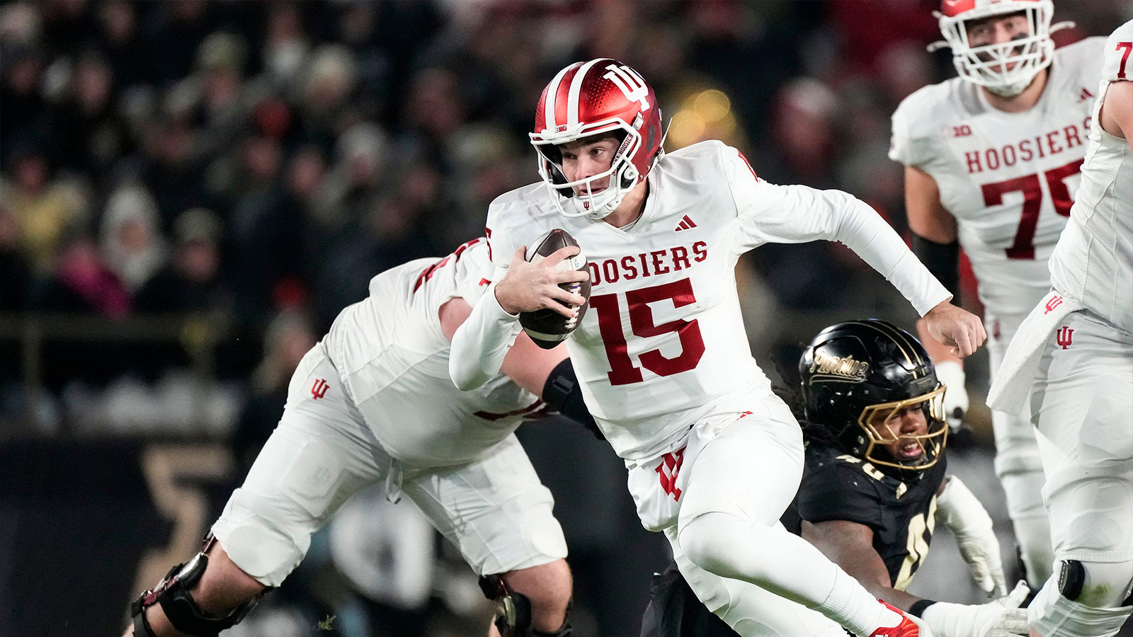Indiana Hoosiers quarterback Fernando Mendoza (15) rushes up the field Friday, Nov. 28, 2025, during the 100th annual Old Oaken Bucket game at Ross-Ade Stadium in West Lafayette.