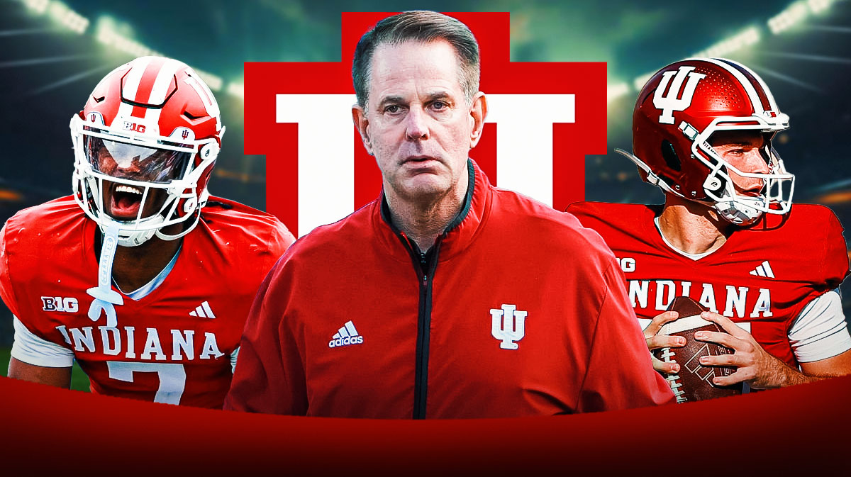 Louis Moore on the left, Curt Cignetti in the Center, Fernando Mendoza on the right. Indiana logo in the background.