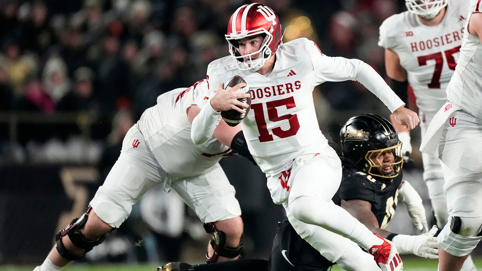 Indiana Hoosiers quarterback Fernando Mendoza (15) rushes up the field Friday, Nov. 28, 2025, during the 100th annual Old Oaken Bucket game at Ross-Ade Stadium in West Lafayette.