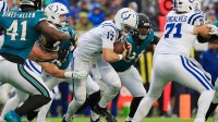 Indianapolis Colts quarterback Daniel Jones (17) is sacked by Jacksonville Jaguars defensive end Danny Striggow (92) during the first quarter of an NFL football game at EverBank Stadium, Sunday, Dec. 7, 2025, in Jacksonville, Fla.