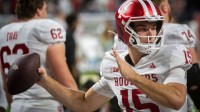 Indiana's Fernando Mendoza (15) gets loose before the Indiana versus Ohio State Big Ten Championship football game at Lucas Oil Stadium.