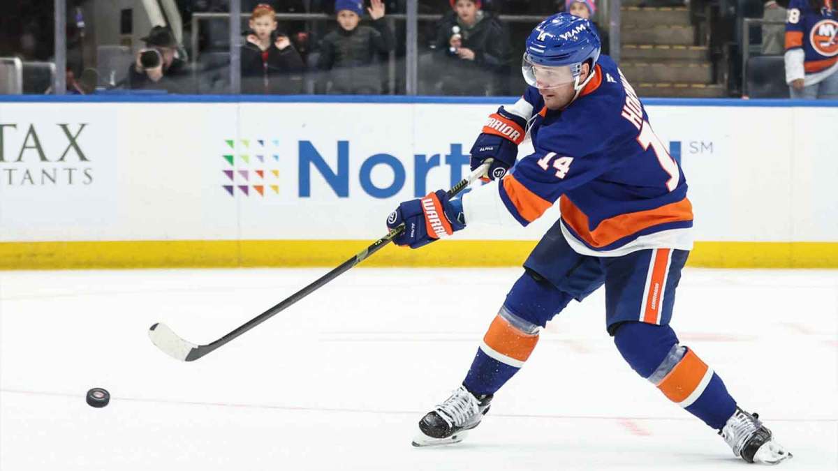 New York Islanders center Bo Horvat (14) goes in for a shot on goal during a shootout in overtime against the Seattle Kraken at UBS Arena.