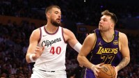 Los Angeles Lakers guard Luka Doncic (77) drives against LA Clippers center Ivica Zubac (40) during the fourth quarter at Crypto.com Arena.