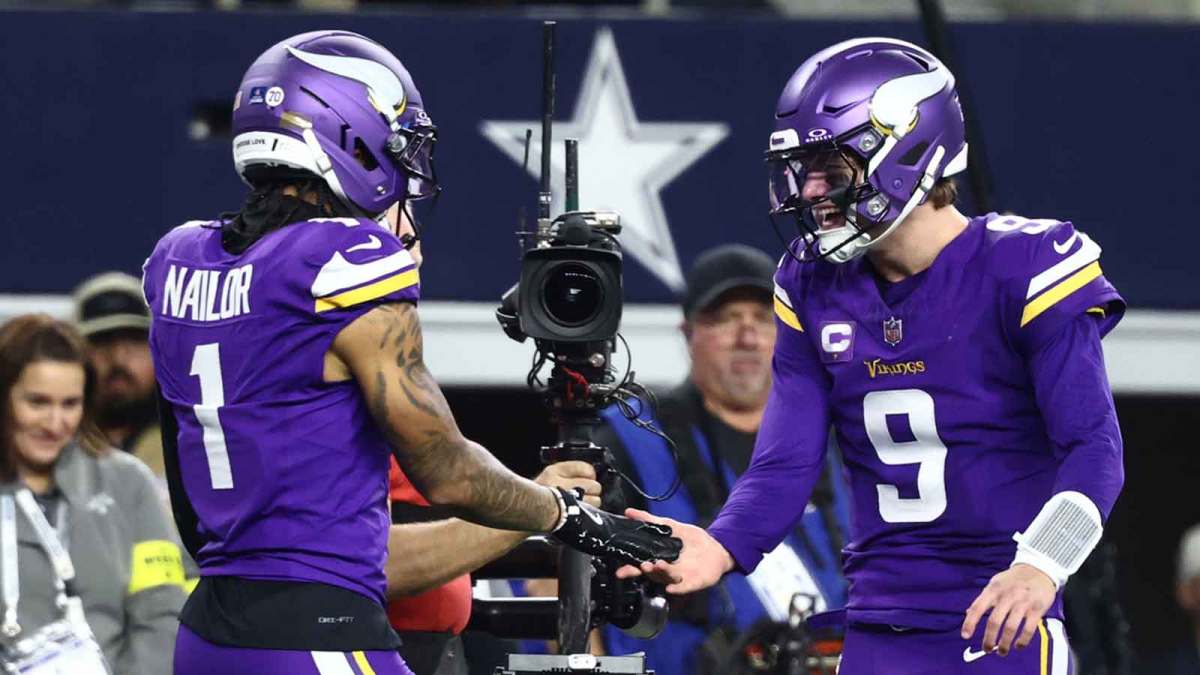 Minnesota Vikings wide receiver Jalen Nailor (1) celebrates with quarterback J.J. McCarthy (9) after a touchdown catch during the second half against the Dallas Cowboys at AT&T Stadium.