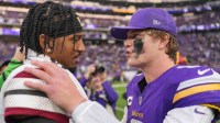 Minnesota Vikings quarterback J.J. McCarthy (9) reacts with Washington Commanders cornerback Marshon Lattimore (2) after the game at U.S. Bank Stadium.