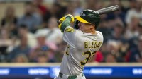 Athletics right fielder JJ Bleday (33) hits a double against the Minnesota Twins in the ninth inning at Target Field.