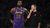 Los Angeles Lakers forward LeBron James (23) with Los Angeles Lakers head coach JJ Redick against the Phoenix Suns during the first half at Crypto.com Arena.