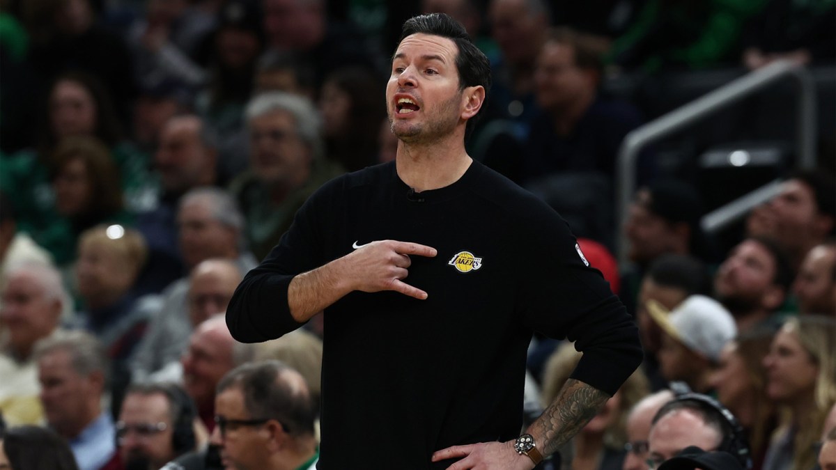 Los Angeles Lakers head coach JJ Redick signals to his players during the first half against the Boston Celtics at TD Garden