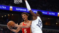 Atlanta Hawks guard Dyson Daniels (5) drives to the basket as Memphis Grizzlies forward Jaren Jackson Jr. (13) defends during the first quarter at FedExForum.
