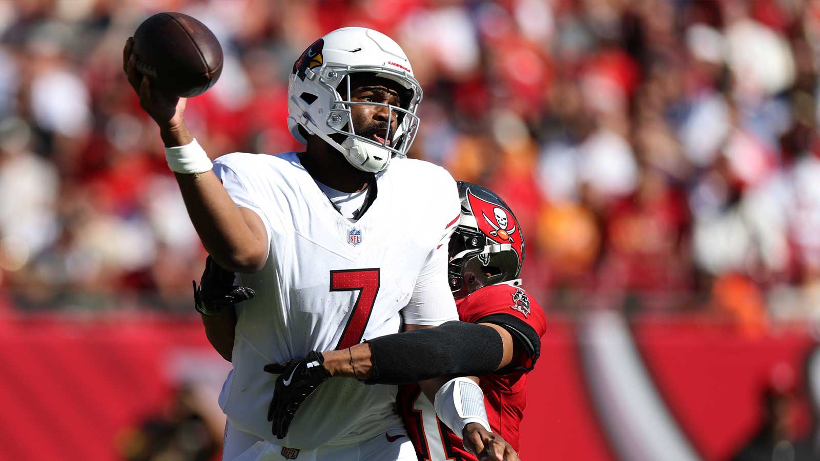 Arizona Cardinals quarterback Jacoby Brissett (7) is pressured by Tampa Bay Buccaneers safety Antoine Winfield Jr. (31) during the first half at Raymond James Stadium. 