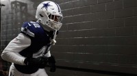 Dallas Cowboys defensive end Jadeveon Clowney (42) runs onto the field prior to the game against the Washington Commanders at Northwest Stadium.