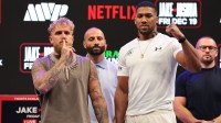 Jake Paul and Anthony Joshua face off after a press conference announcing their heavyweight boxing match at Kayesa Center.