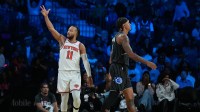 New York Knicks guard Jalen Brunson (11) reacts as Orlando Magic forward Paolo Banchero (5) walks away during the third quarter at T-Mobile Arena. Mandatory Credit: Kirby Lee-Imagn Images