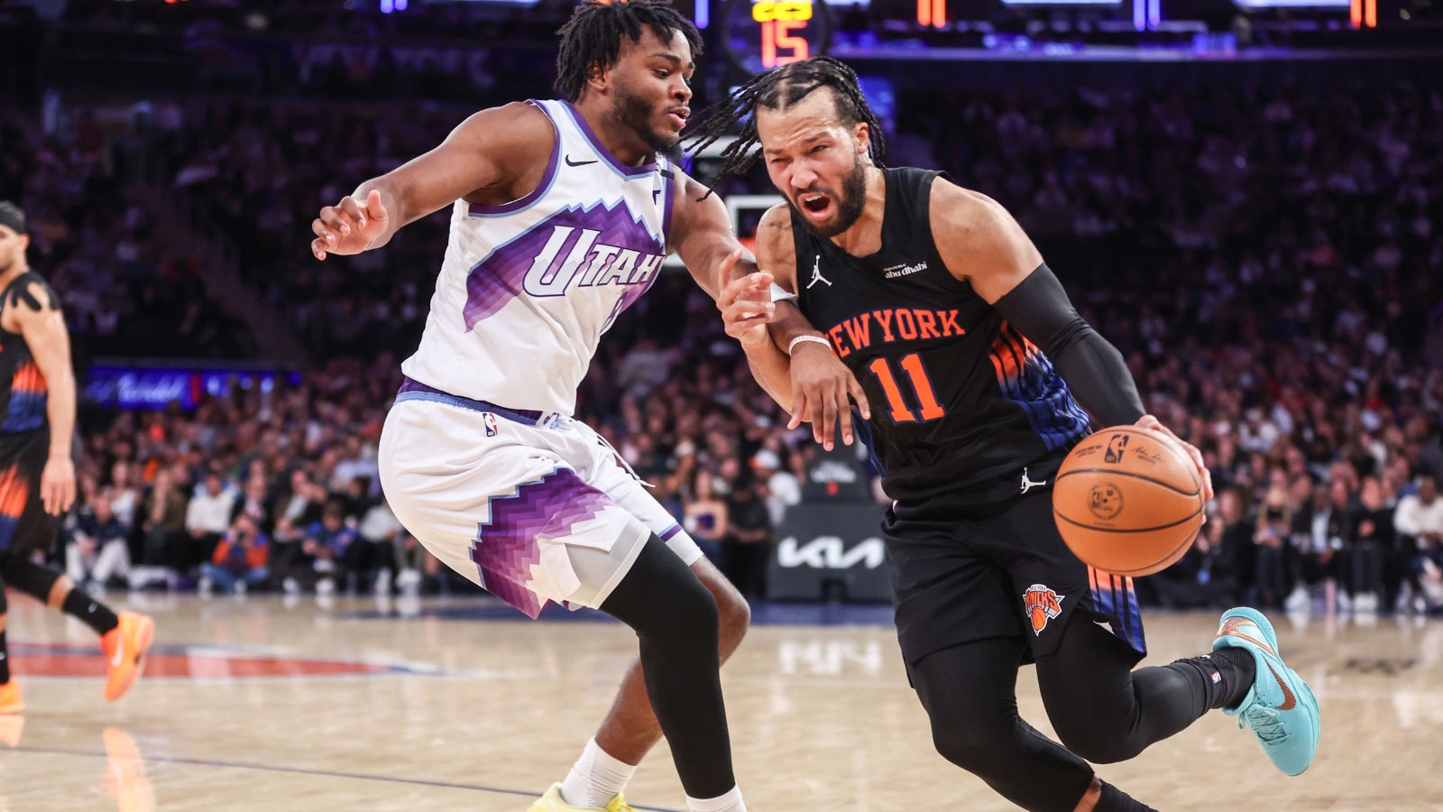 New York Knicks guard Jalen Brunson (11) looks to drive past Utah Jazz guard Isaiah Collier (8) in the third quarter at Madison Square Garden.