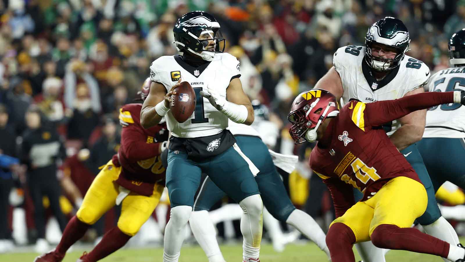 Philadelphia Eagles quarterback Jalen Hurts (1) passes against the Washington Commanders in the second half at Northwest Stadium.