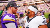 Minnesota Vikings quarterback Carson Wentz (11) and Philadelphia Eagles quarterback Jalen Hurts (1) react after the game at U.S. Bank Stadium.