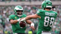 Philadelphia Eagles tight end Dallas Goedert (88) celebrates with quarterback Jalen Hurts (1) after scoring a touchdown against the New York Giants in the fourth quarter at Lincoln Financial Field.
