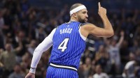 Orlando Magic guard Jalen Suggs (4) reacts after a basket against the Miami Heat in the third quarter at Kia Center.