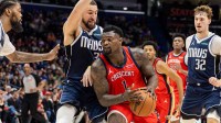 New Orleans Pelicans forward Zion Williamson (1) dribbles against Dallas Mavericks guard Klay Thompson (31) during the second half at Smoothie King Center.