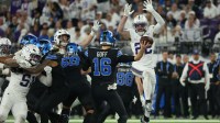 Detroit Lions quarterback Jared Goff (16) passes the ball under pressure from Minnesota Vikings safety Harrison Smith (22) in the second half at U.S. Bank Stadium.