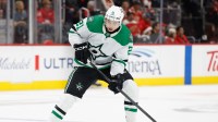 Dallas Stars left wing Jason Robertson (21) skates with the puck in the first period against the Detroit Red Wings at Little Caesars Arena.