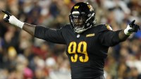 Washington Commanders defensive tackle Javon Kinlaw (99) reacts after a play against the Chicago Bears during the second quarter at Northwest Stadium.