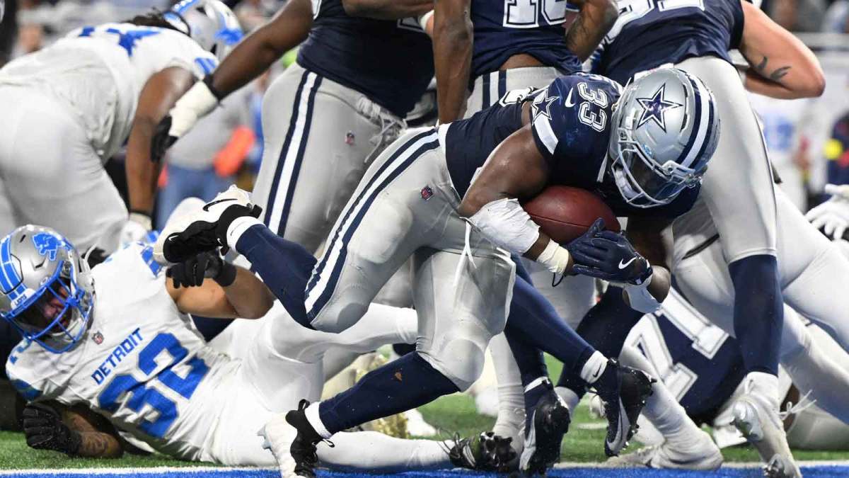 Dallas Cowboys running back Javonte Williams (33) scores a touchdown during the second half against the Detroit Lions at Ford Field.