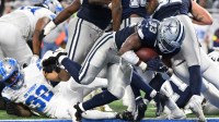 Dallas Cowboys running back Javonte Williams (33) scores a touchdown during the second half against the Detroit Lions at Ford Field.