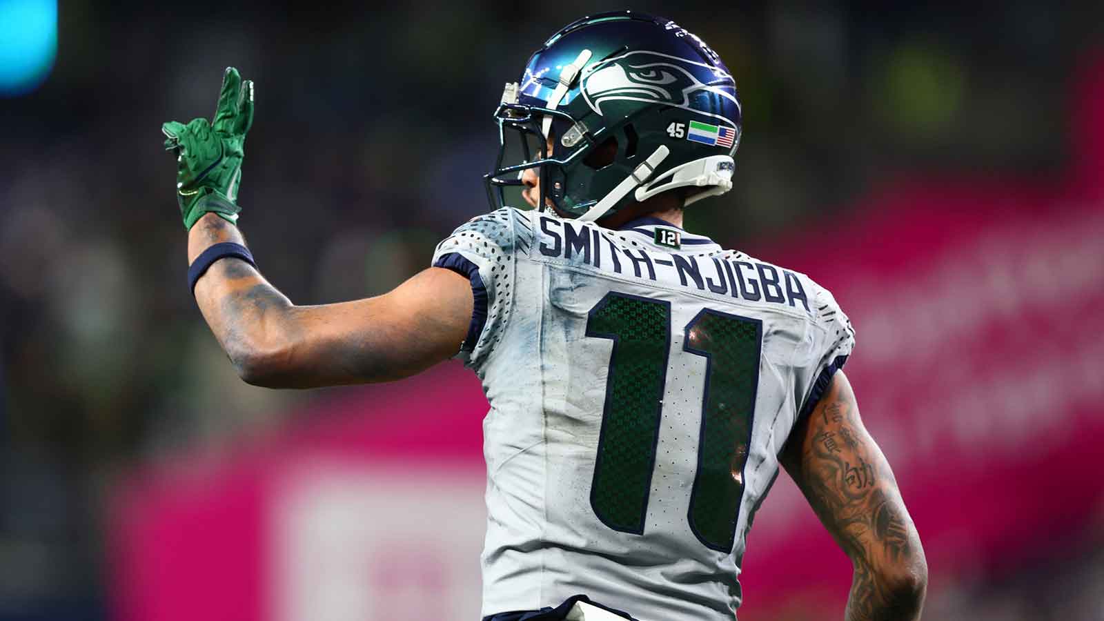 Seattle Seahawks wide receiver Jaxon Smith-Njigba (11) celebrates after scoring a touchdown against the Los Angeles Rams in overtime at Lumen Field. 