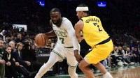 Boston Celtics guard Jaylen Brown (7) controls the ball while Indiana Pacers guard Andrew Nembhard (2) defends during the first half at TD Garden.