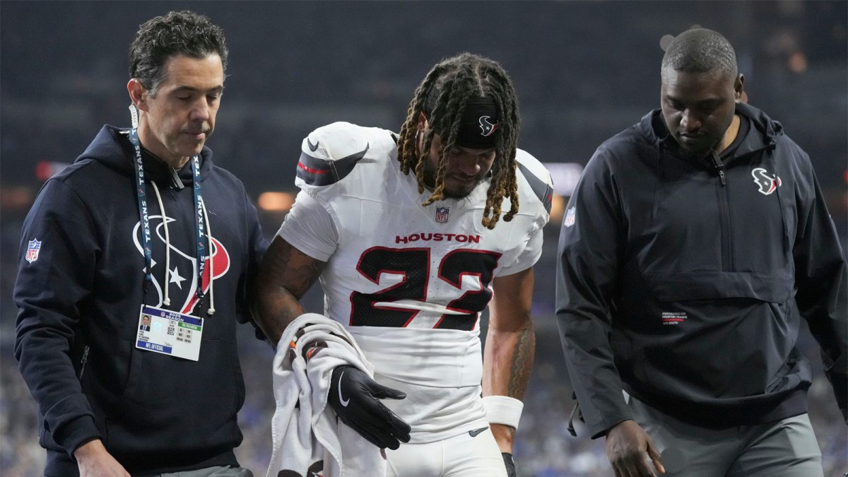 Houston Texans safety Jaylen Reed (23) is helped off the field following an injury Sunday, Nov. 30, 2025, during a game against the Indianapolis Colts at Lucas Oil Stadium in Indianapolis.