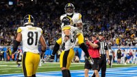 Pittsburgh Steelers running back Jaylen Warren (30) celebrates a touchdown against Detroit Lions with running back Kenneth Gainwell (14) during the second half at Ford Field in Detroit on Sunday, Dec. 21, 2025.