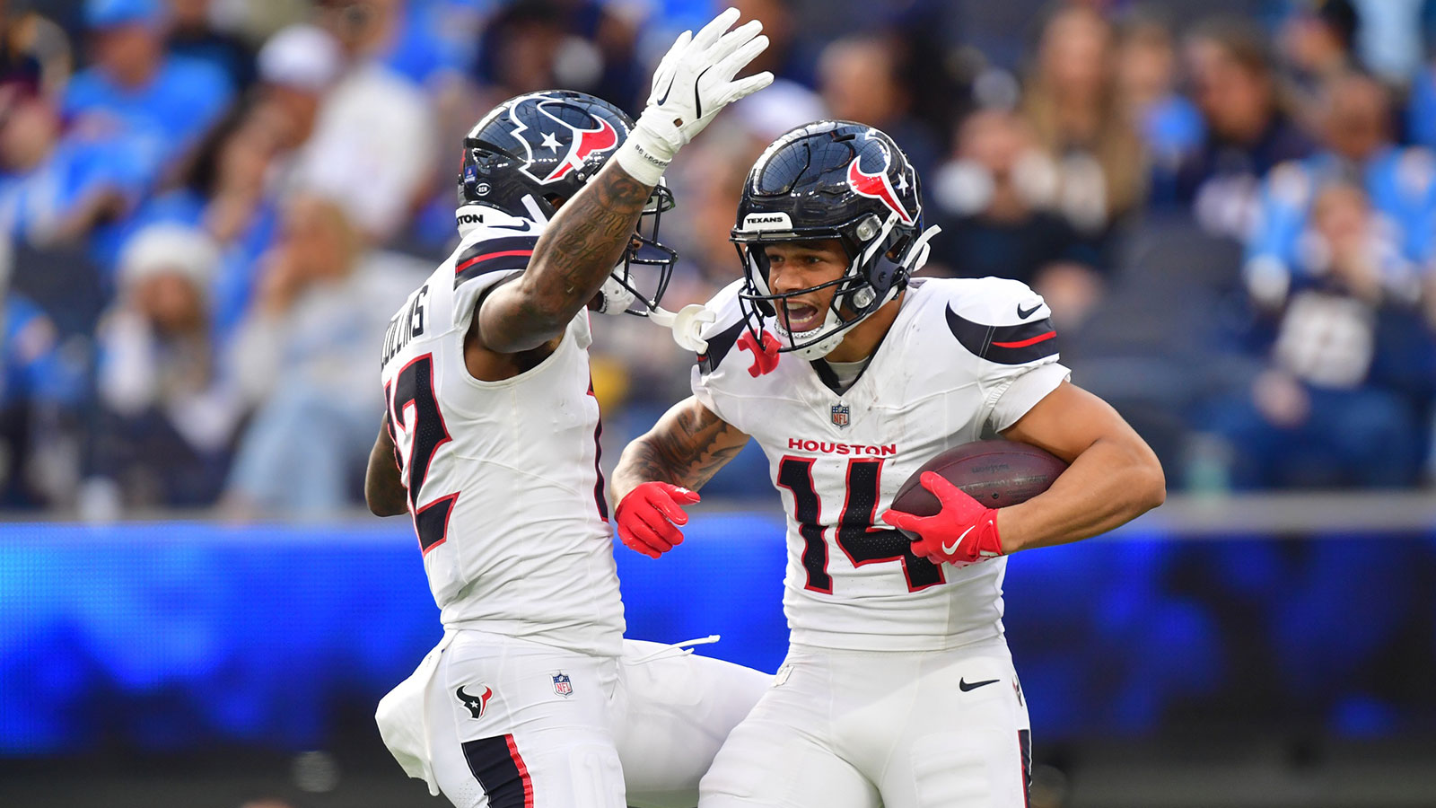 Houston Texans wide receiver Jaylin Noel (14) reacts with wide receiver Nico Collins (12) after catching a touchdown against the Los Angeles Chargers during the first half at SoFi Stadium. 