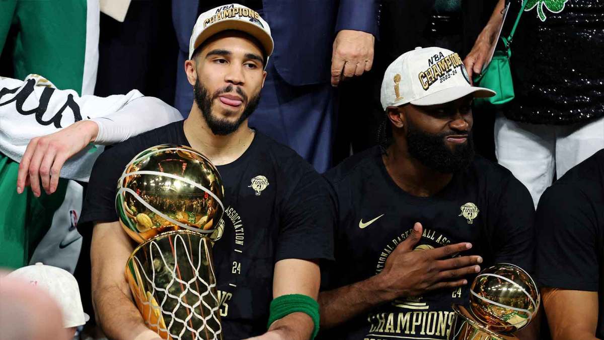 Boston Celtics forward Jayson Tatum (0) and guard Jaylen Brown (7) celebrates with the Larry O’Brian Trophy after beating the Dallas Mavericks in game five of the 2024 NBA Finals to win the NBA Championship at TD Garden.