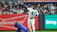 New York Yankees second baseman Jazz Chisholm Jr. (13) forces out Toronto Blue Jays third baseman Ernie Clement (22) and tries to turn a double play during the eighth inning during game four of the ALDS round for the 2025 MLB playoffs at Yankee Stadium.