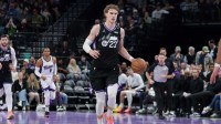 Jazz forward Lauri Markkanen (23) brings the ball up the court against the Sacramento Kings during the second half at Delta Center