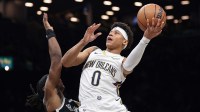 New Orleans Pelicans guard Jeremiah Fears (0) drives to the basket against Brooklyn Nets guard Terance Mann (14) during the first quarter at Barclays Center.