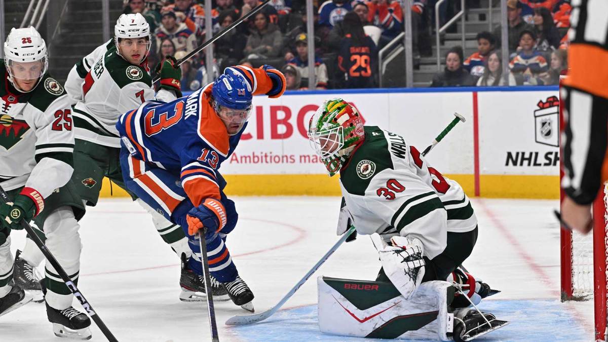 Minnesota Wild defenseman Jonas Brodin (25) with Edmonton Oilers center Mattias Janmark (13) battle in front of Minnesota Wild goalie Jesper Wallstedt (30) during the third period at Rogers Place
