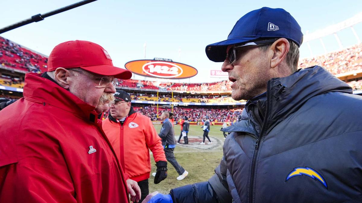 Kansas City Chiefs head coach Andy Reid, left, and Los Angeles Chargers head coach Jim Harbaugh shake hands following a Chargers victory at GEHA Field at Arrowhead Stadium.