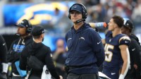 Los Angeles Chargers head coach Jim Harbaugh looks on from the sidelines against the Houston Texans during the first half at SoFi Stadium.