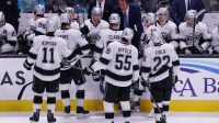 Los Angeles Kings head coach Jim Hiller talks with center Anze Kopitar (11), right winger Adrian Kempe (9), defenseman Brandt Clarke (92), right winger Quinton Byfield (55), left winger Kevin Fiala (22) and the team in the third period against the San Jose Sharks at SAP Center in San Jose.