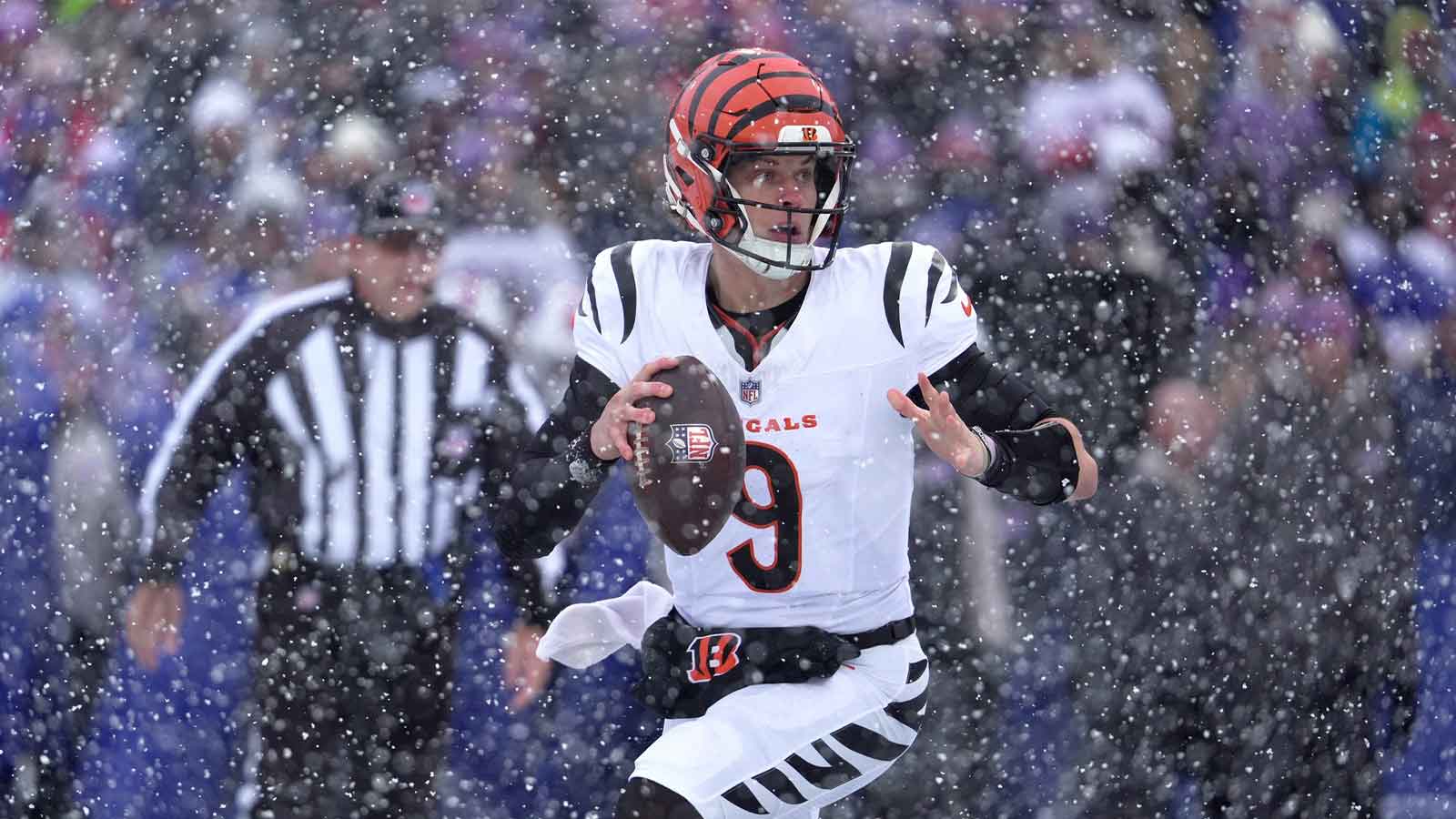 Cincinnati Bengals quarterback Joe Burrow runs to the sideline looking for an open receiver during first half action at Highmark Stadium in Orchard Park on Dec. 7, 2025.